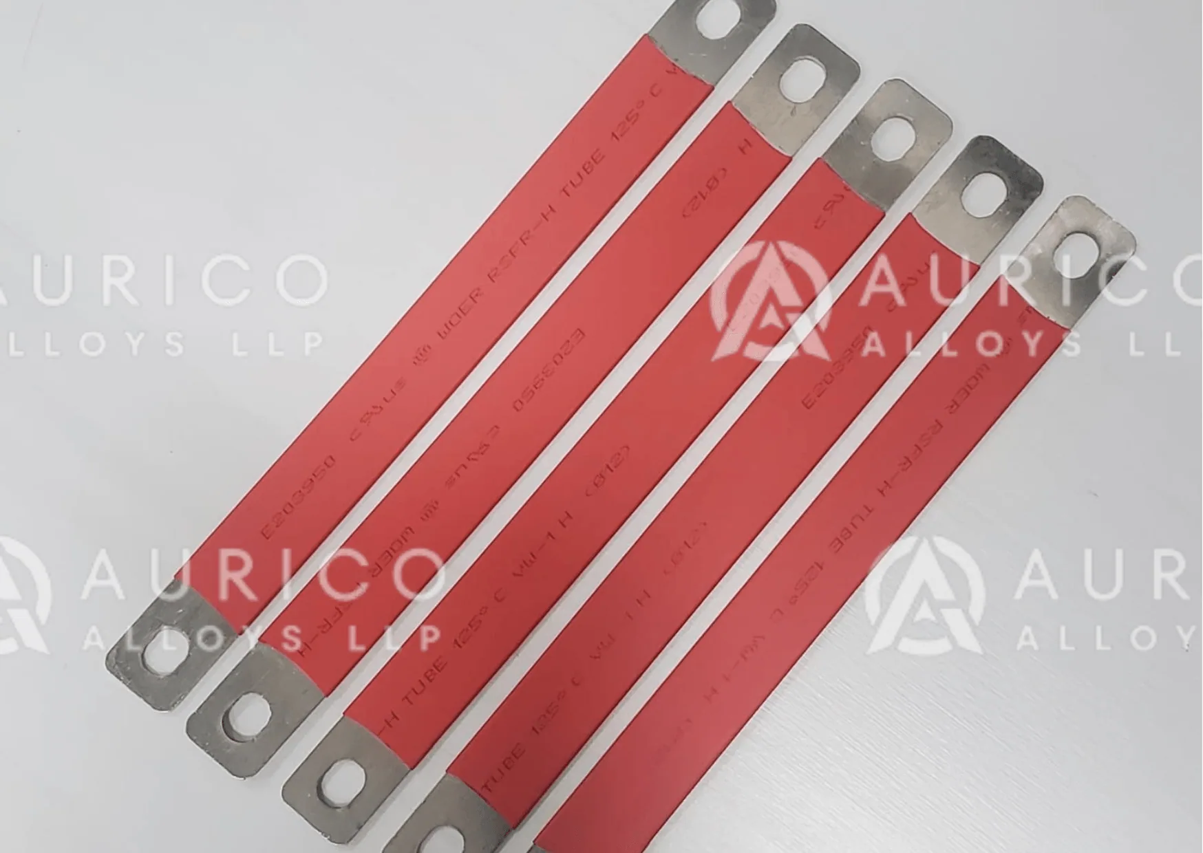 Busbar links with red insulating sleeves and bare punched ends